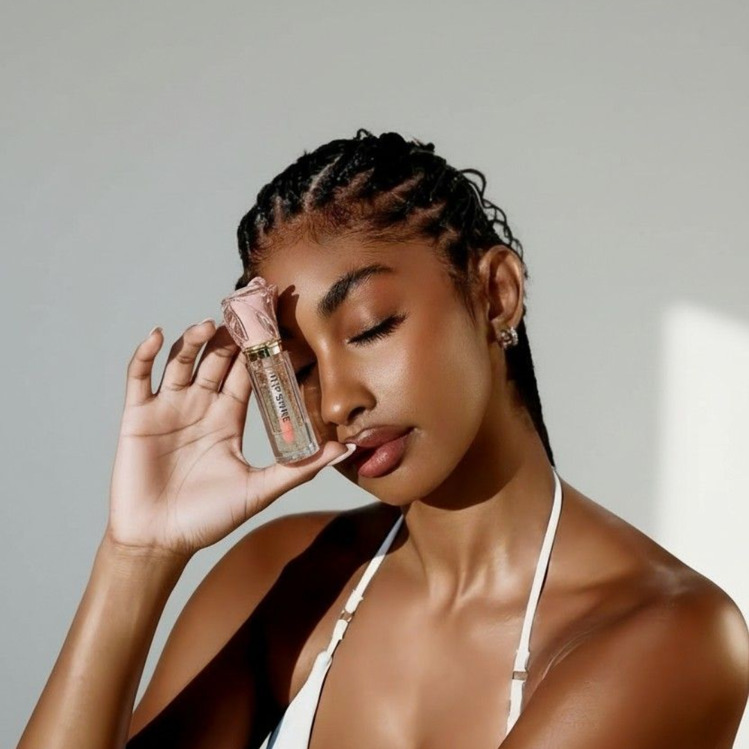 Luxury lip shine with gold flakes and nourishing oils